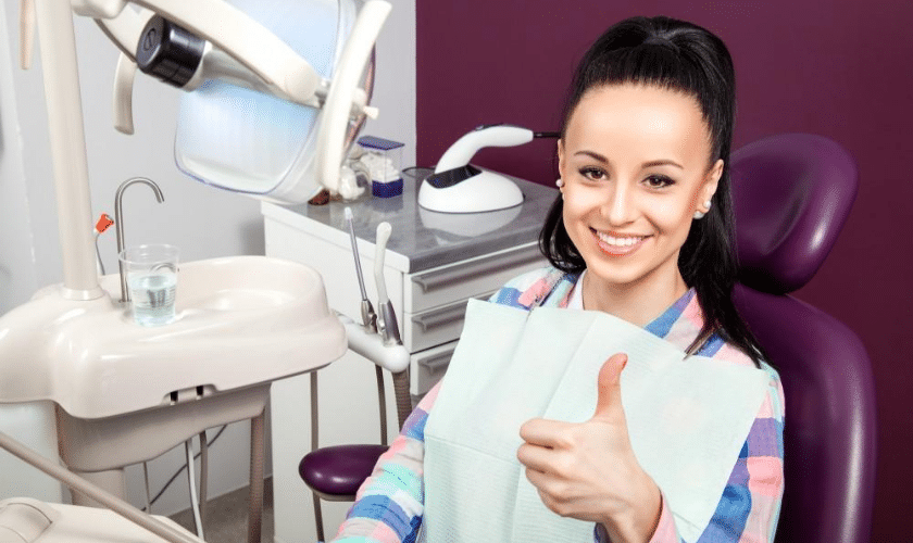 Dentist explaining common dental issues and solutions to a patient